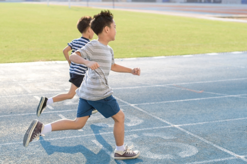 Chronic Disease Prevention 1 Kids running on a track.